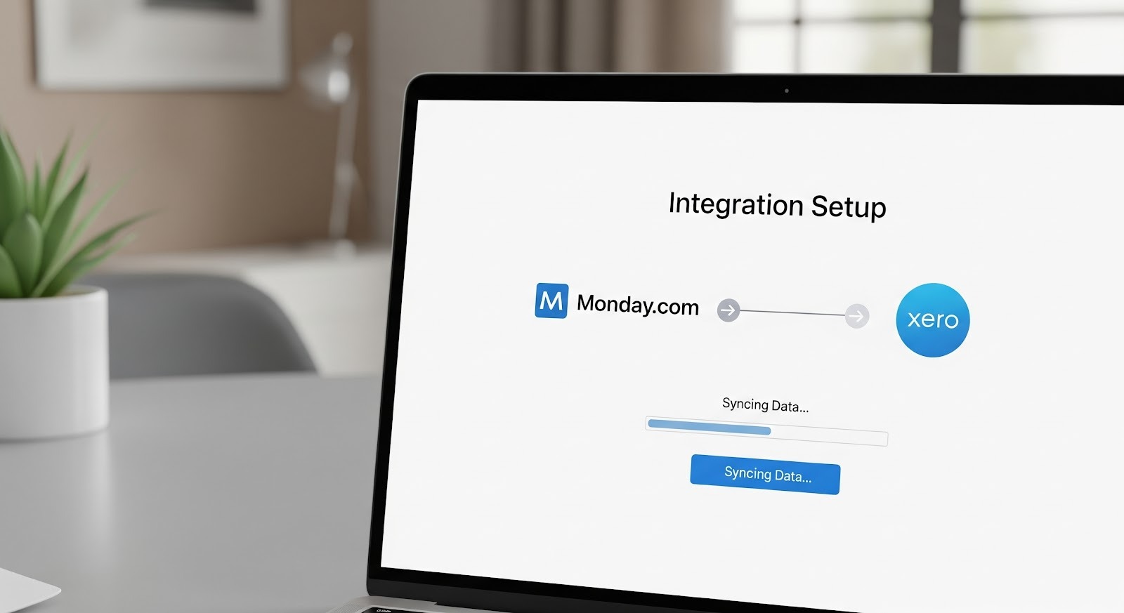 An image of a laptop screen showing an integration setup between Monday.com and Xero, with a progress bar indicating data syncing in progress.
