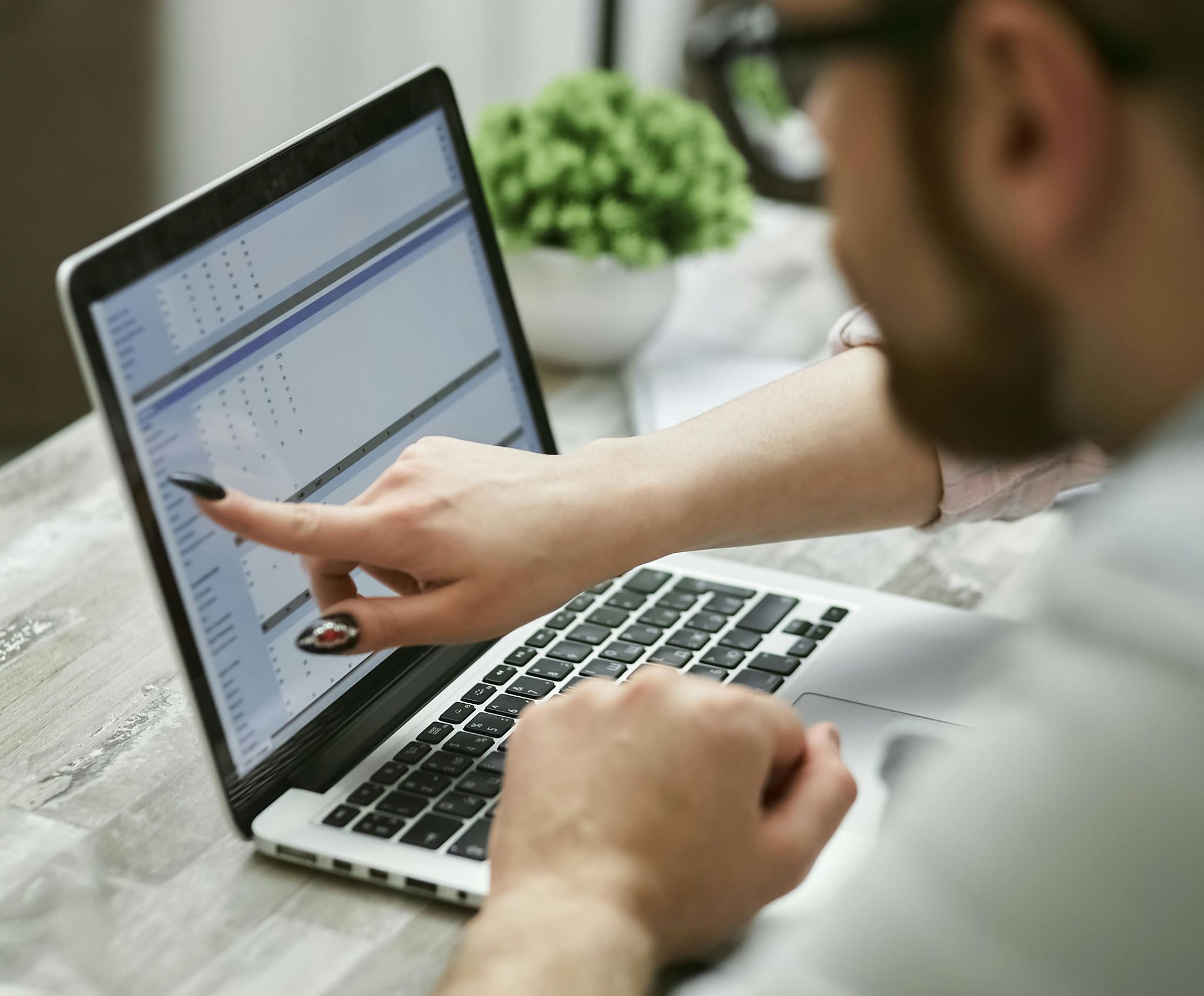 Man pointing at a computer screen with Data 