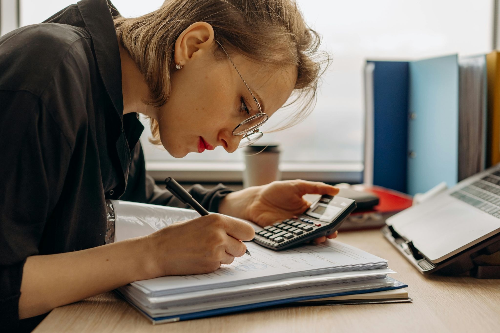 Lady writing down numbers 